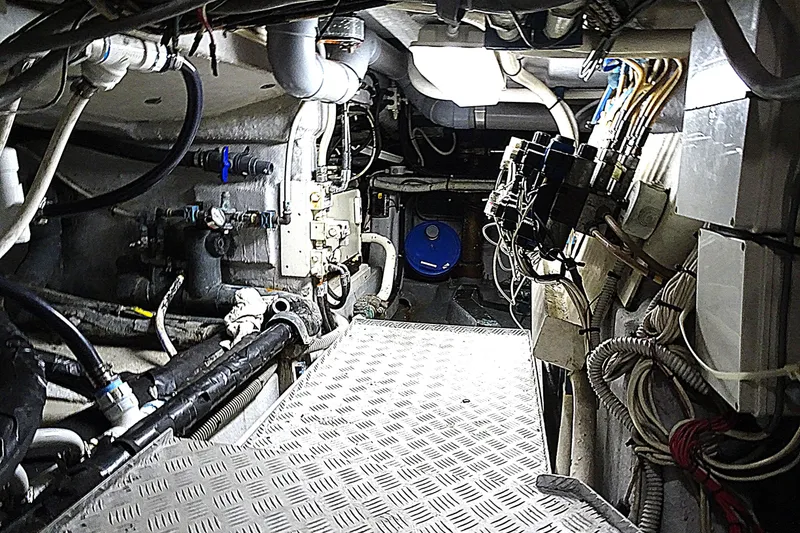 Slide: The Image of Engine room of 2010 Azimut 100 Leonardo yacht, showcasing complex machinery and wiring. - 67