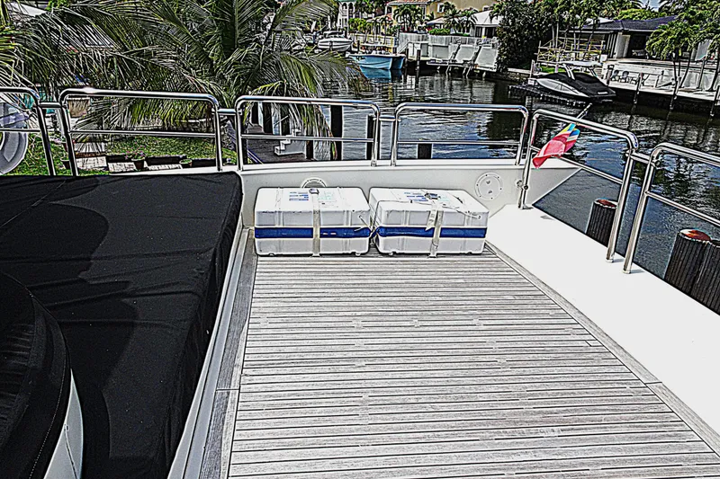 Slide: The Image of Deck view of 2010 Azimut 100 Leonardo yacht with wooden flooring and safety equipment. - 79