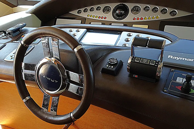 Slide: The Image of Cockpit of 2010 Azimut 100 Leonardo yacht with steering wheel and control panel. - 26