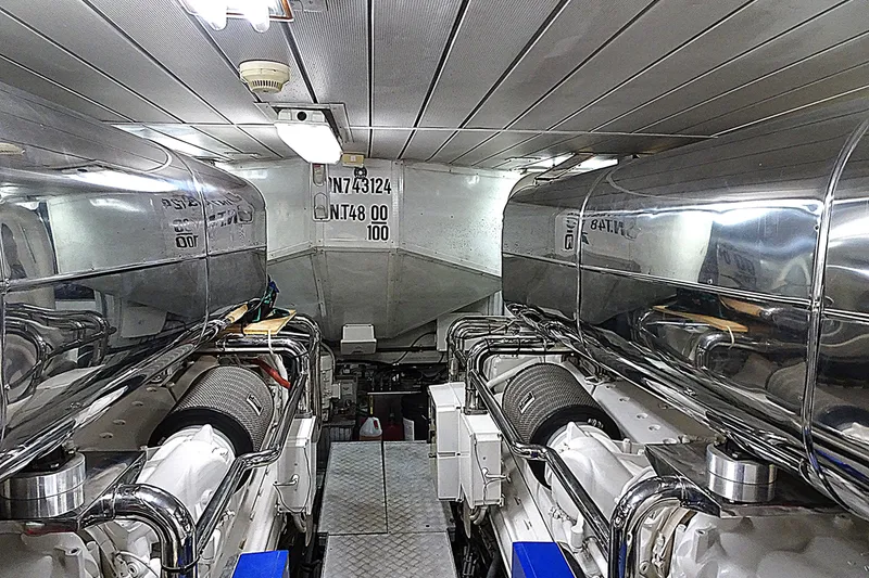 Slide: The Image of Engine room of 2010 Azimut 100 Leonardo yacht, featuring dual polished engines. - 55