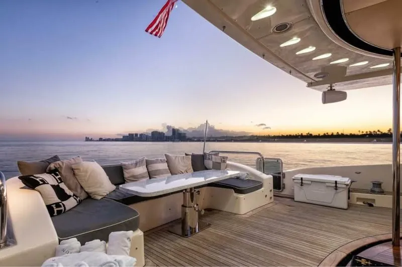 Slide: The Image of Luxurious 2010 Azimut 100 Leonardo yacht deck at sunset, featuring elegant seating and ocean view. - 35
