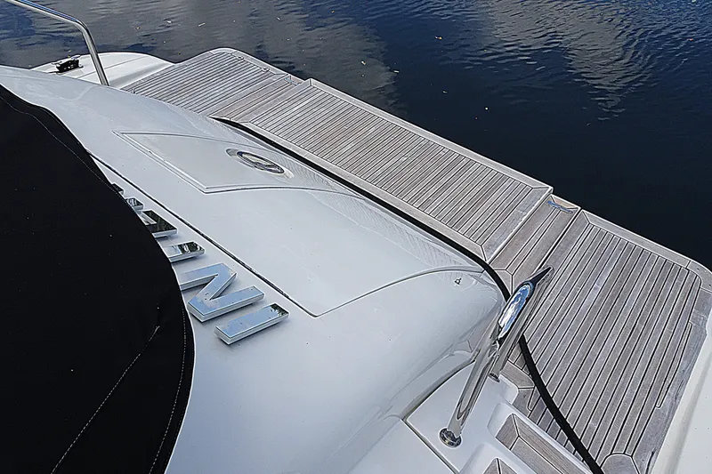 Slide: The Image of Azimut 100 Leonardo 2010 yacht deck with sleek design and water reflection. - 86