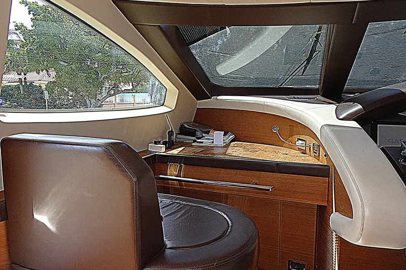 Slide: The Image of Luxurious helm station of 2010 Azimut 100 Leonardo yacht with leather seating and wooden accents. - 20