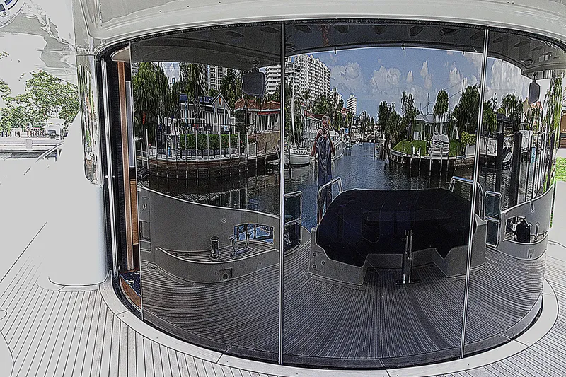 Slide: The Image of Reflective glass doors on a 2010 Azimut 100 Leonardo yacht, showcasing waterfront view. - 85