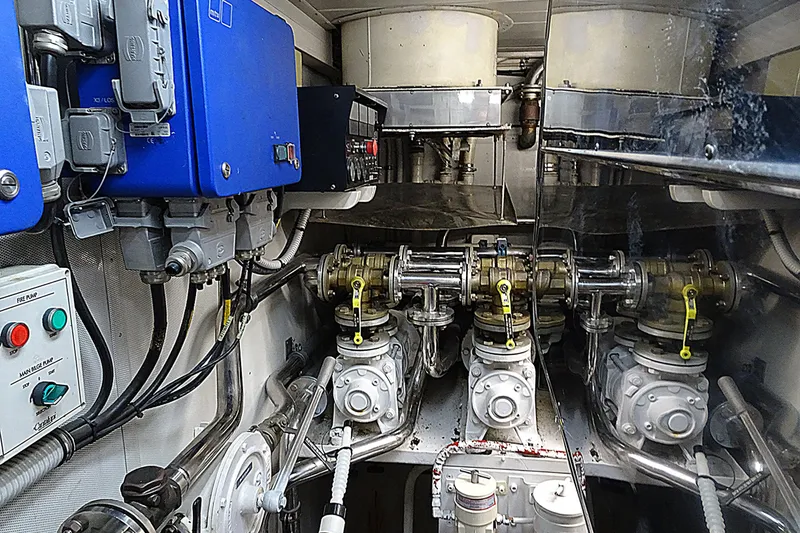 Slide: The Image of Engine room of 2010 Azimut 100 Leonardo yacht, showcasing complex machinery and control systems. - 69