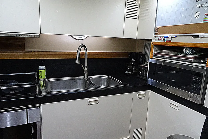 Slide: The Image of Modern kitchen in 2010 Azimut 100 Leonardo yacht with sleek appliances and black countertops. - 47