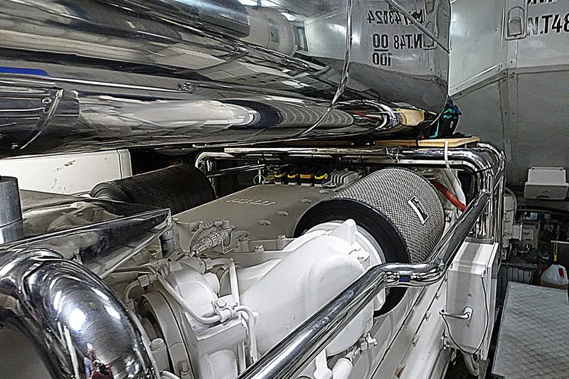Slide: The Image of Engine room of a 2010 Azimut 100 Leonardo yacht, showcasing polished components. - 56
