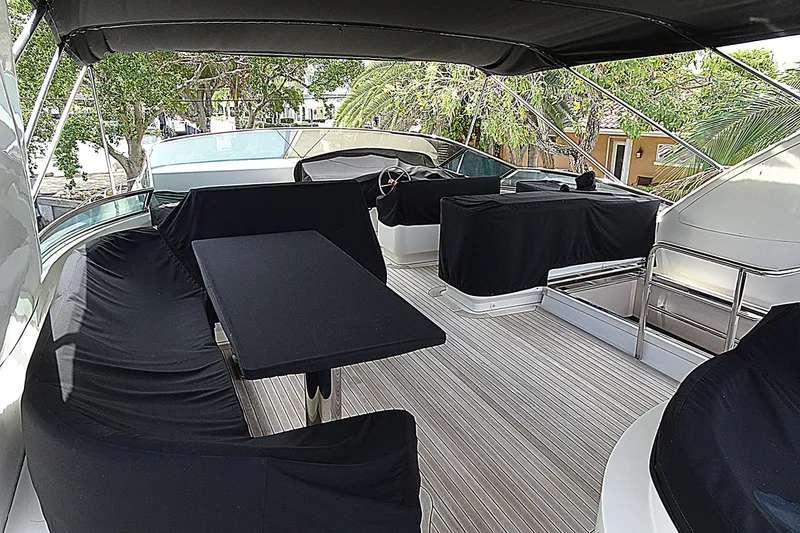 Slide: The Image of Luxurious 2010 Azimut 100 Leonardo yacht deck with covered seating and dining area. - 80