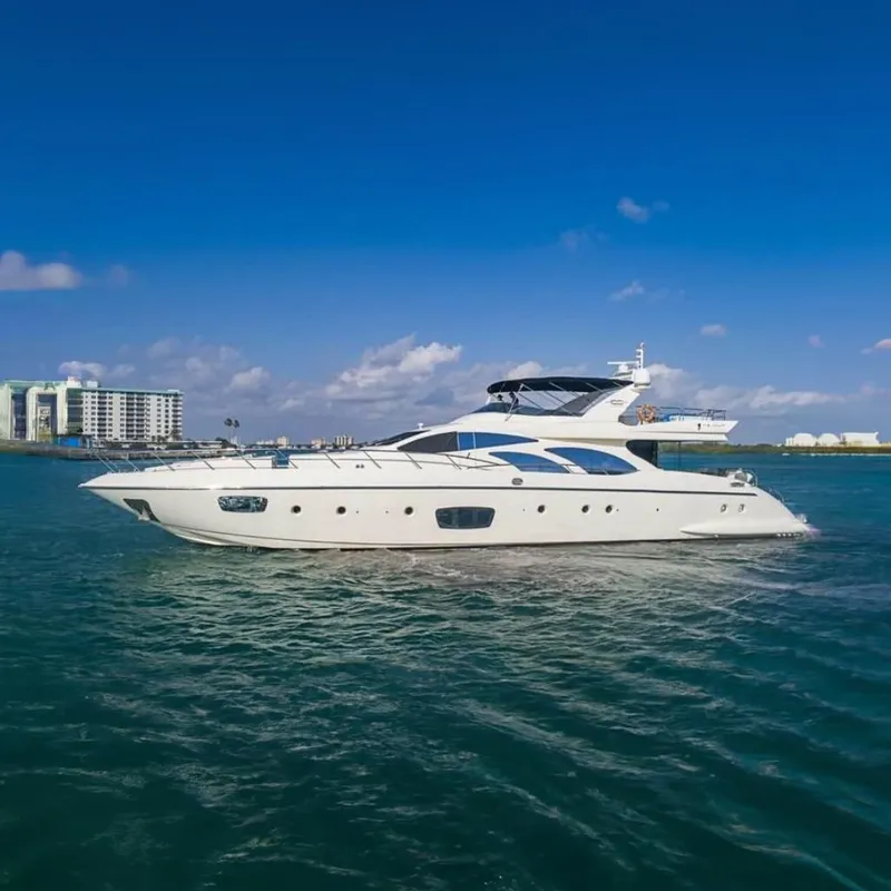 Slide: The Image of Luxury 2010 Azimut 100 Leonardo yacht cruising on clear blue waters. - 0