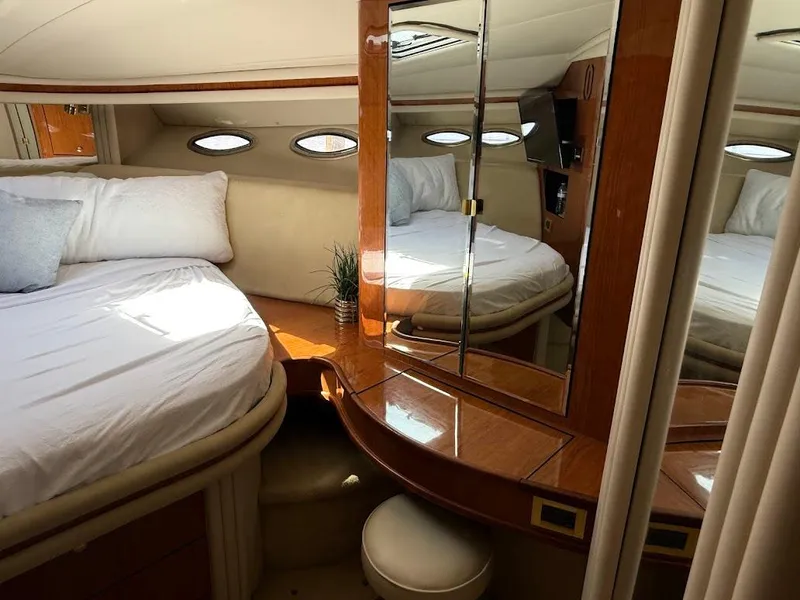 Slide: The Image of Luxurious cabin interior of 2000 Sea Ray 510 Sundancer yacht with elegant wood finish. - 28
