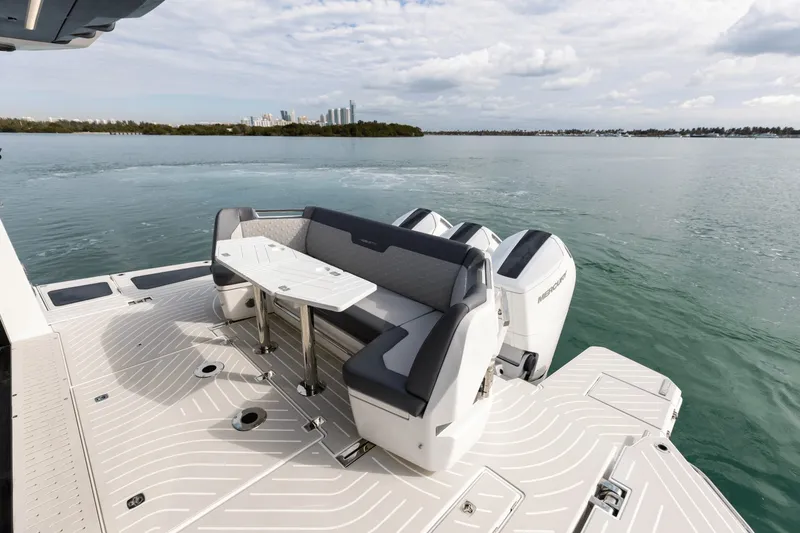 Slide: The Image of The image shows the stern of a 2027 Galeon 435 GTO with a sleek seating area and two engines. - 39