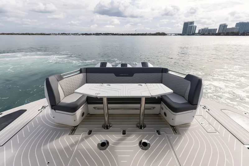 Slide: The Image of The stern of the Galeon 435 GTO features a stylish seating area overlooking the water. - 37