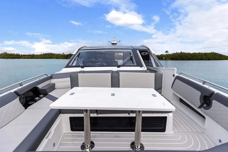 Slide: The Image of The image shows the cockpit of a 2027 Galeon 435 GTO with stylish seating and a table. - 25
