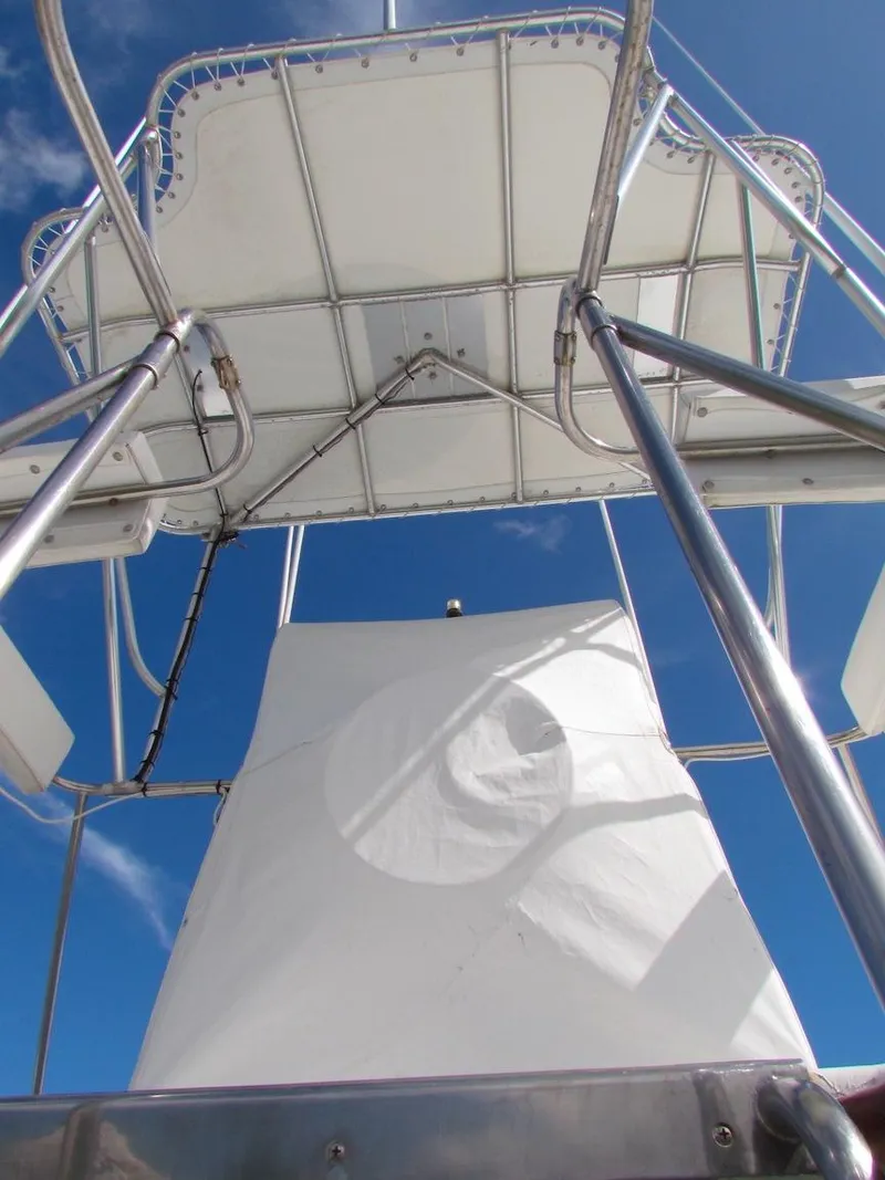 Slide: The Image of View of Hargrave 67 Motor Yacht's upper deck structure against a clear blue sky. - 16