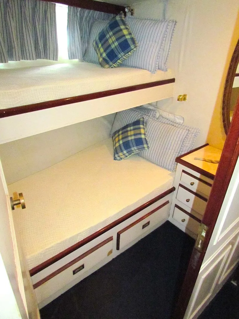 Slide: The Image of Bunk beds in a 1972 Hargrave 67 Motor Yacht cabin with plaid pillows. - 28