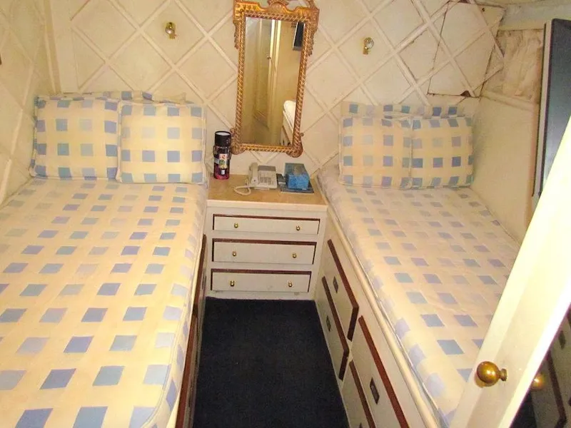 Slide: The Image of Interior cabin of 1972 Hargrave 67 Motor Yacht with twin beds and vintage decor. - 32