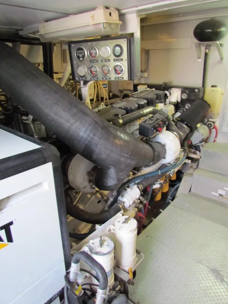 Slide: The Image of Engine room of a 1972 Hargrave 67 Motor Yacht, featuring gauges and machinery. - 34