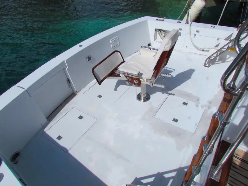Slide: The Image of 1972 Hargrave 67 Motor Yacht deck with fishing chair and ocean view. - 7