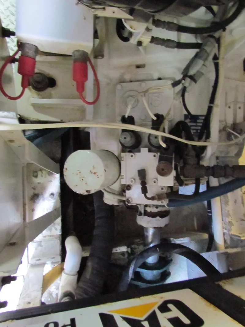 Slide: The Image of Engine room of a 1972 Hargrave 67 Motor Yacht, showcasing mechanical components and wiring. - 36