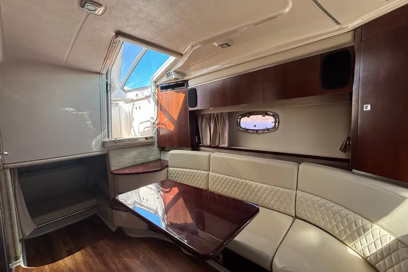 Slide: The Image of Luxurious interior of 2018 Chaparral 310 Signature yacht with elegant seating and wood finishes. - 23