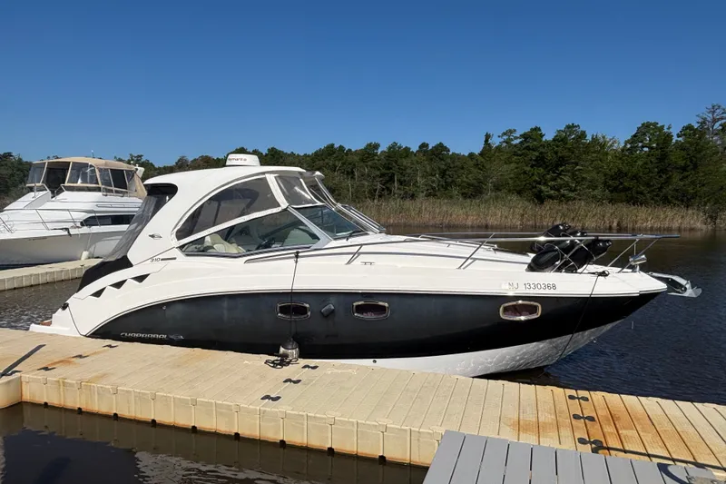 Slide: The Image of 2018 Chaparral 310 Signature boat docked on a sunny day. - 3