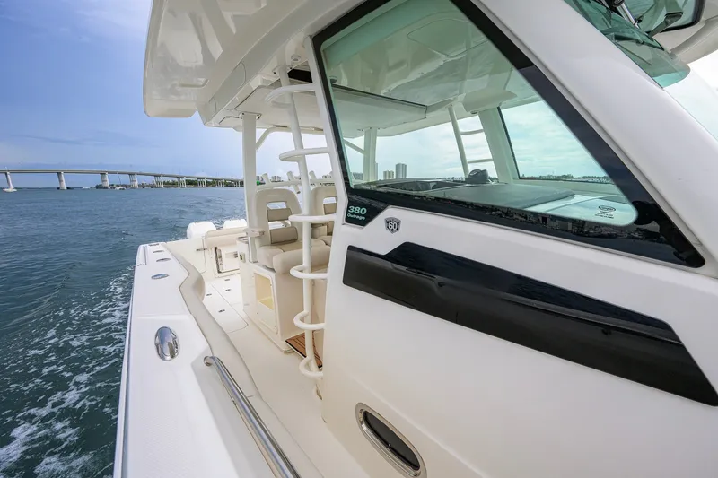 Slide: The Image of 2018 Boston Whaler 380 Outrage cruising near a bridge on a sunny day. - 31