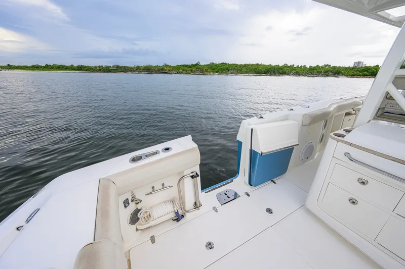Slide: The Image of 2018 Boston Whaler 380 Outrage boat deck with ocean view and lush shoreline. - 61