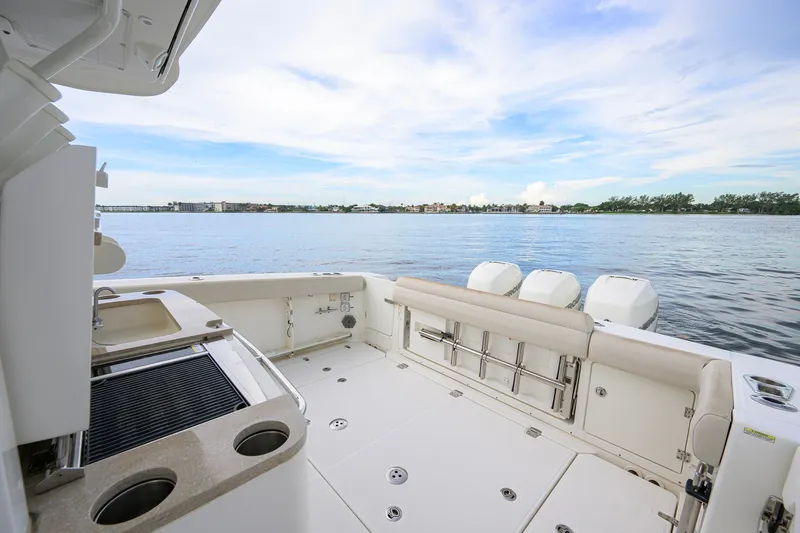 Slide: The Image of 2018 Boston Whaler 380 Outrage boat deck with seating and ocean view. - 59
