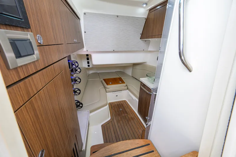 Slide: The Image of Interior cabin of 2018 Boston Whaler 380 Outrage with wood accents and seating. - 37