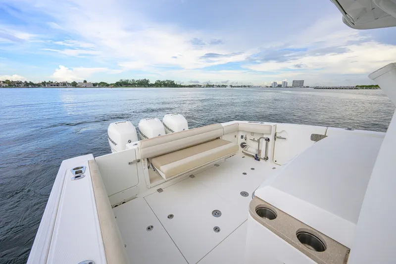 Slide: The Image of 2018 Boston Whaler 380 Outrage boat deck with seating and ocean view. - 48