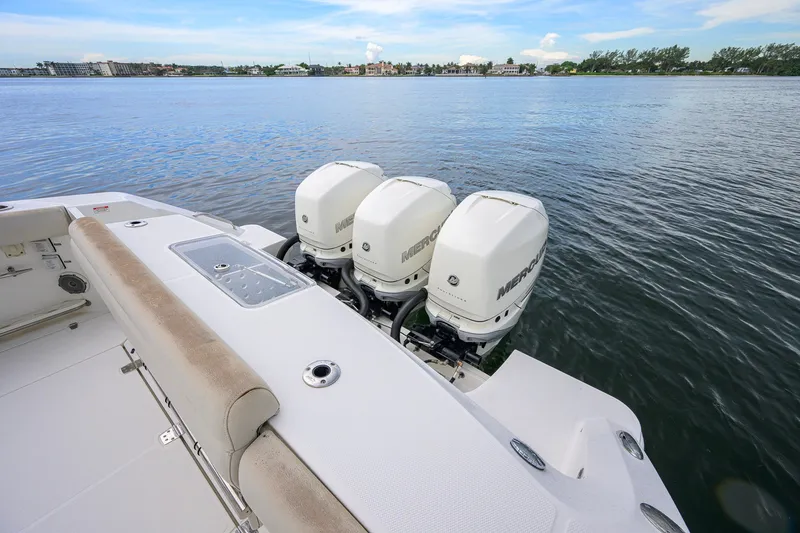 Slide: The Image of 2018 Boston Whaler 380 Outrage with triple Mercury engines on calm water. - 64