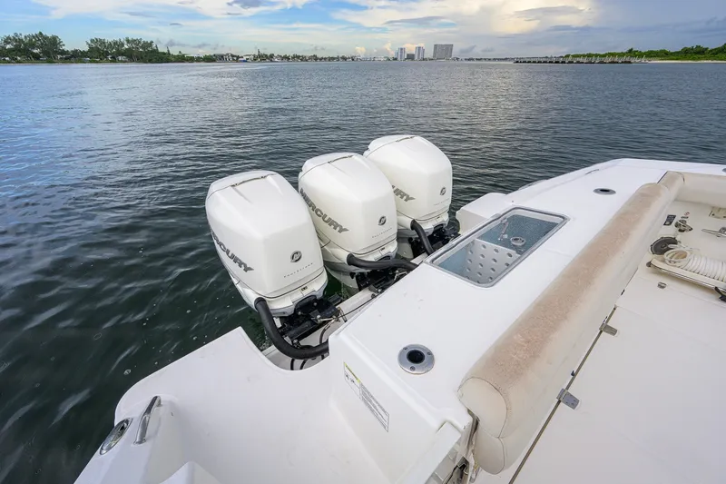 Slide: The Image of 2018 Boston Whaler 380 Outrage with triple Mercury engines on calm water. - 66