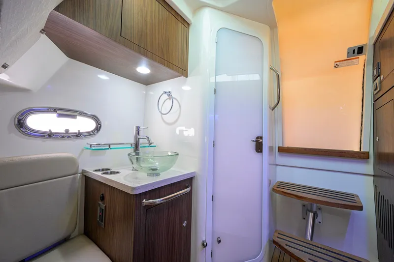 Slide: The Image of Luxurious interior of 2018 Boston Whaler 380 Outrage with modern sink and wooden accents. - 43