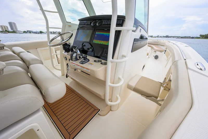 Slide: The Image of 2018 Boston Whaler 380 Outrage helm with advanced navigation systems and luxurious seating. - 36