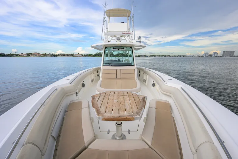 Slide: The Image of 2018 Boston Whaler 380 Outrage boat with spacious seating and scenic water view. - 26