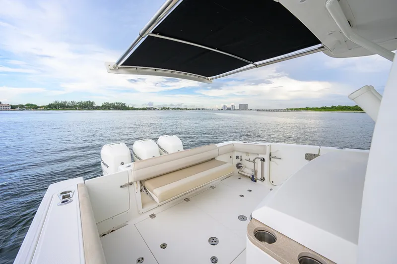 Slide: The Image of 2018 Boston Whaler 380 Outrage boat with spacious deck and scenic water view. - 4