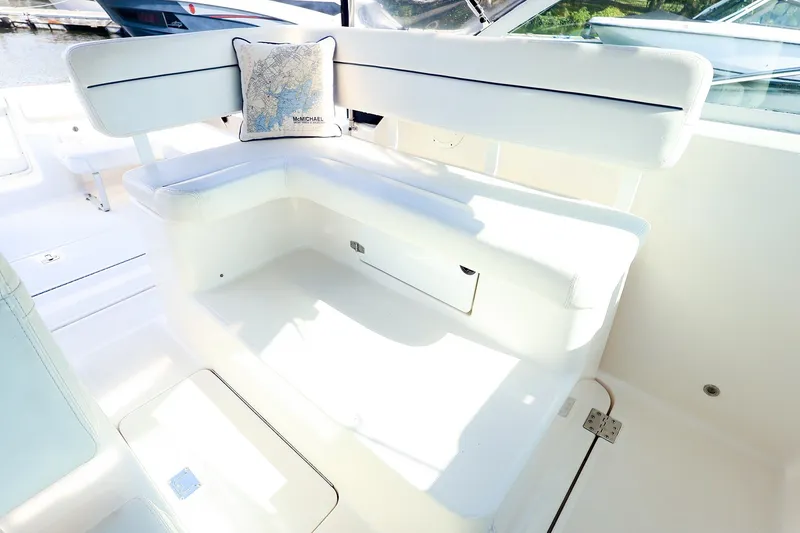 Slide: The Image of 2003 Tiara Yachts 2900 Coronet interior with white seating and decorative pillow. - 19