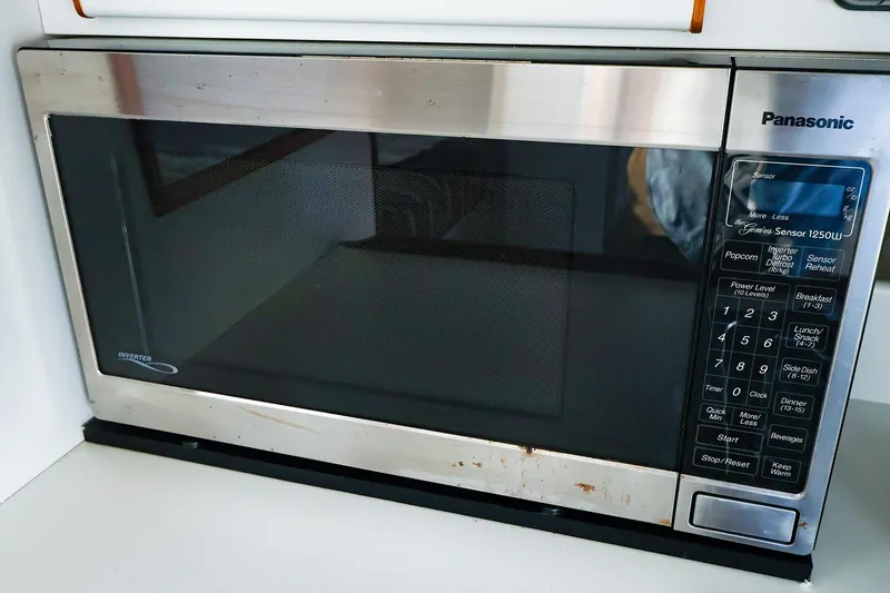 Slide: The Image of A Panasonic microwave with stainless steel finish and digital control panel. - 24