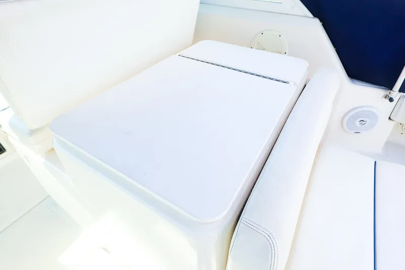 Slide: The Image of 2003 Tiara Yachts 2900 Coronet interior seating area with white upholstery. - 17