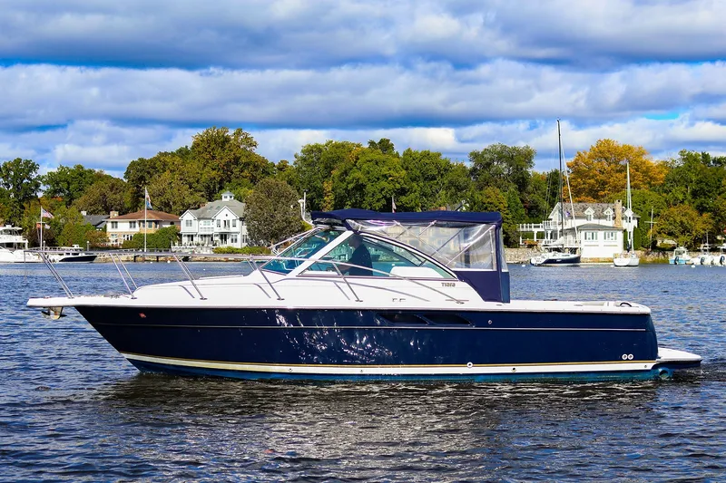 The Image of 2003 Tiara Yachts 2900 Coronet on a scenic lake with houses and trees in the background. - 0