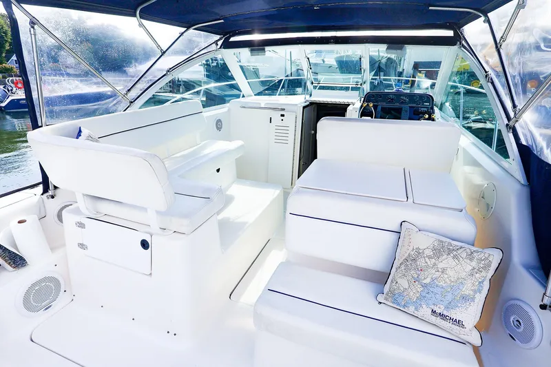 Slide: The Image of 2003 Tiara Yachts 2900 Coronet interior with white seating and nautical decor. - 12