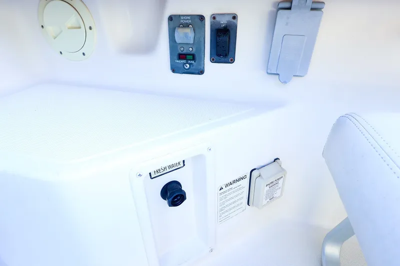 Slide: The Image of Control panel on a 2003 Tiara Yachts 2900 Coronet, featuring shore power and fresh water access. - 29