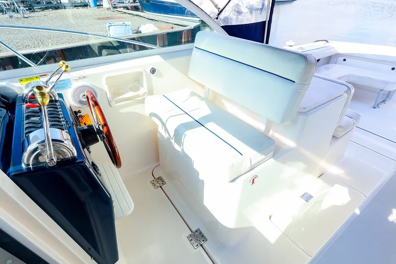 Slide: The Image of 2003 Tiara Yachts 2900 Coronet cockpit with helm, seating, and controls. - 10