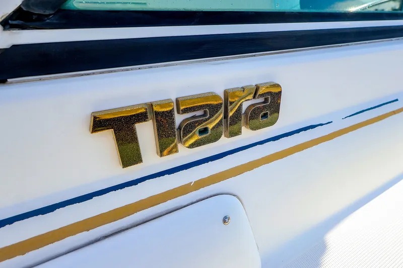 Slide: The Image of Close-up of 2003 Tiara Yachts 2900 Coronet logo on boat exterior. - 21
