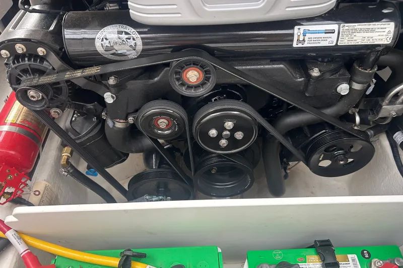 Slide: The Image of Engine compartment of a 2023 Monterey M6 boat, featuring belts and pulleys. - 25