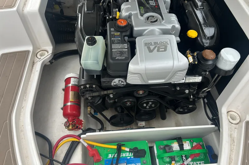 Slide: The Image of 2023 Monterey M6 boat engine compartment with Big Block V8 engine and battery setup. - 22