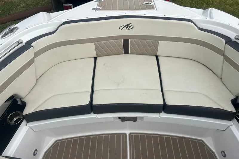 Slide: The Image of 2023 Monterey M6 boat interior with cushioned seating and elegant design. - 19