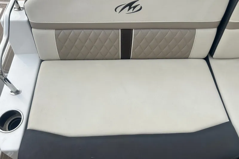 Slide: The Image of 2023 Monterey M6 boat seat with quilted upholstery and integrated cup holder. - 12