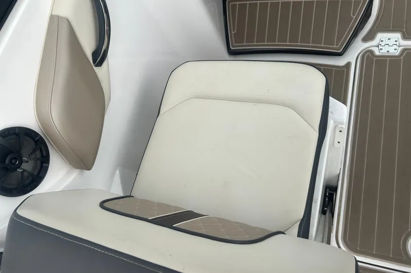Slide: The Image of 2023 Monterey M6 boat interior with beige seating and speaker detail. - 17