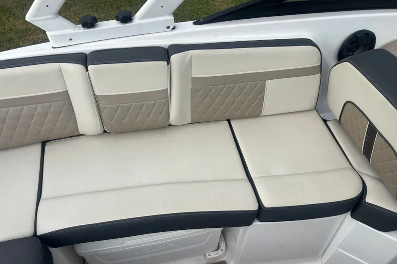 Slide: The Image of Luxurious seating on 2023 Monterey M6 boat with quilted beige and cream upholstery. - 14